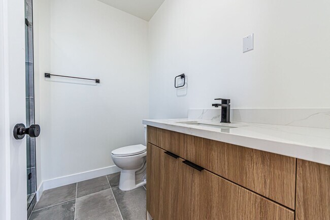 Building Photo - Modern 4-Bedroom Townhome-Style Living in ...