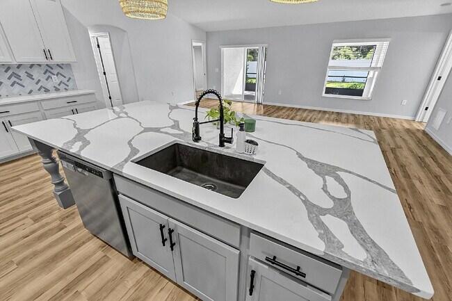 Building Photo - Modern 4-Bedroom, 3-Bath Home with Private In-Law Suite – Palm Coast, FL