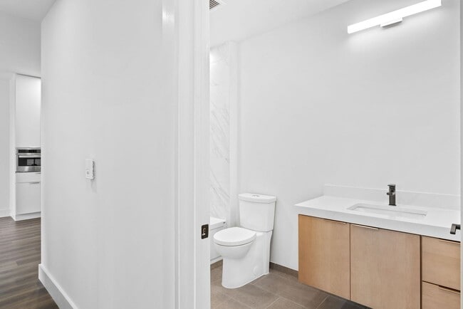 Building Photo - 2 Bedroom Corner-Unit with Wooded Balcony ...