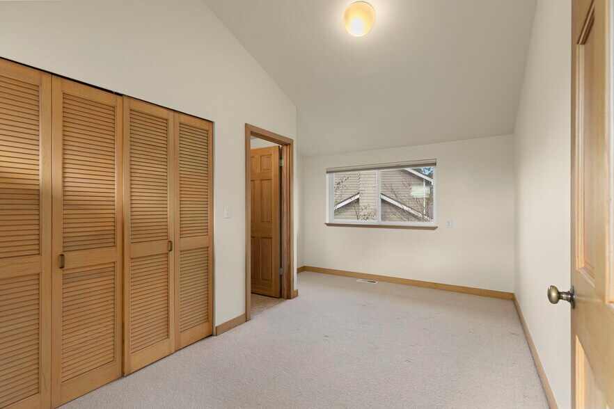 One more bedroom upstairs with ½ bath, vaulted ceilings. - 1123 Cherry Ave NE