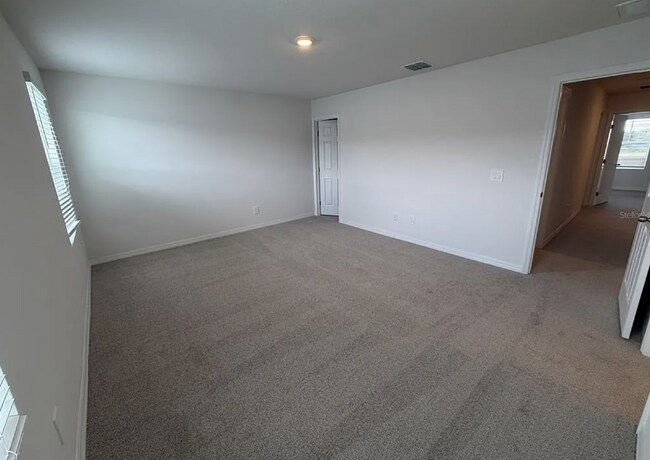 Building Photo - "Spacious 3-Bedroom Townhouse with Granite Elegance in St. Cloud – 4543 Rangeland Way"