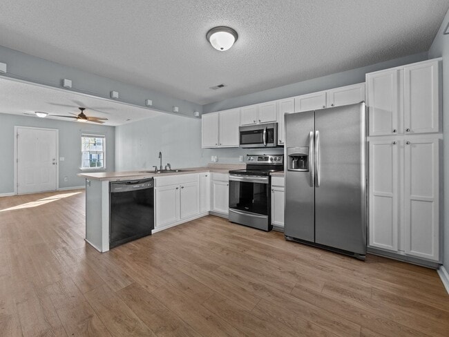 Building Photo - Welcome to Raymond's Landing!