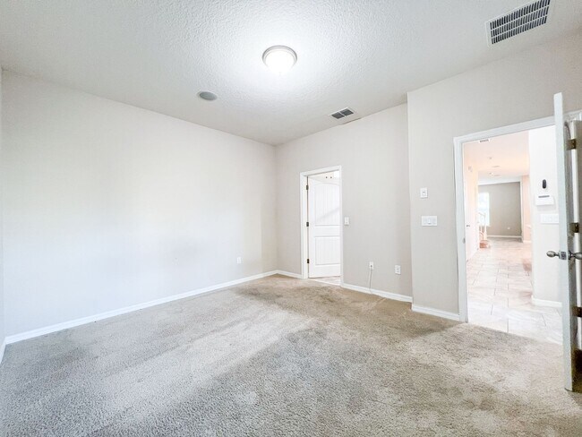 Building Photo - Spacious 4-Bedroom Townhome in Harmony – A Perfect Blend of Nature & Comfort!