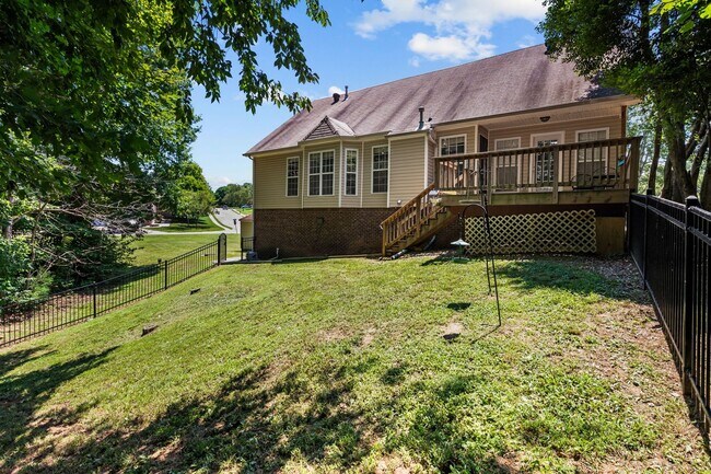 Building Photo - Stunning Stone Fireplace • Finished Basement • Fenced Yard