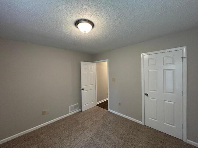 Building Photo - Spacious 3BR/2BA Lake Community Home | Soaring High Ceilings, Fireplace & 2-Car Garage