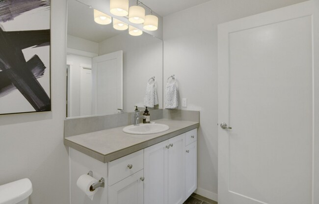 Building Photo - Modern Ground-Level Condo in River Terrace...