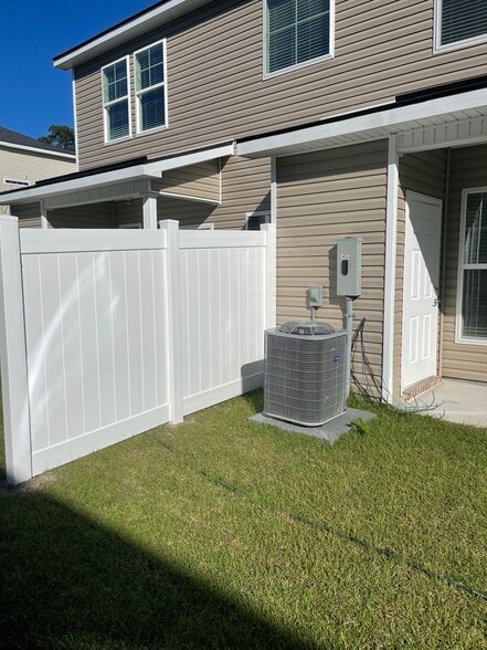 Privacy fencing on each side of outdoor space - 102 Reese Way