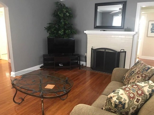 Living room w/ tv (Roku)& dvd (Fireplace is ornamental only.) - 1423 Bronough N St