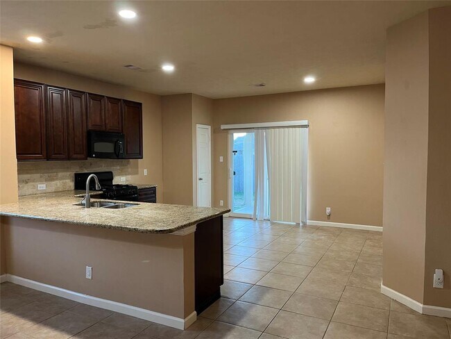 Building Photo - 10803 Woodwind Shadows Dr