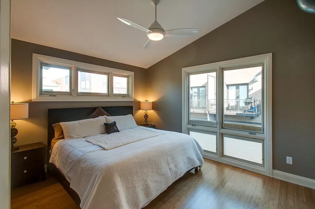 Large bedroom with high ceilings and large windows. - 324 Van Buren St