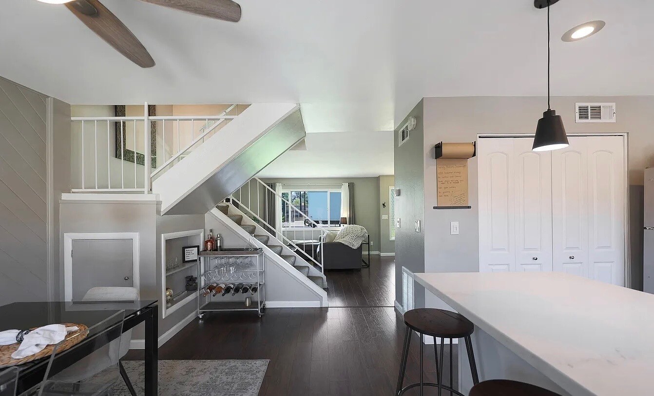 great view of stairs with storage under - 2936 E Clarendon Ave