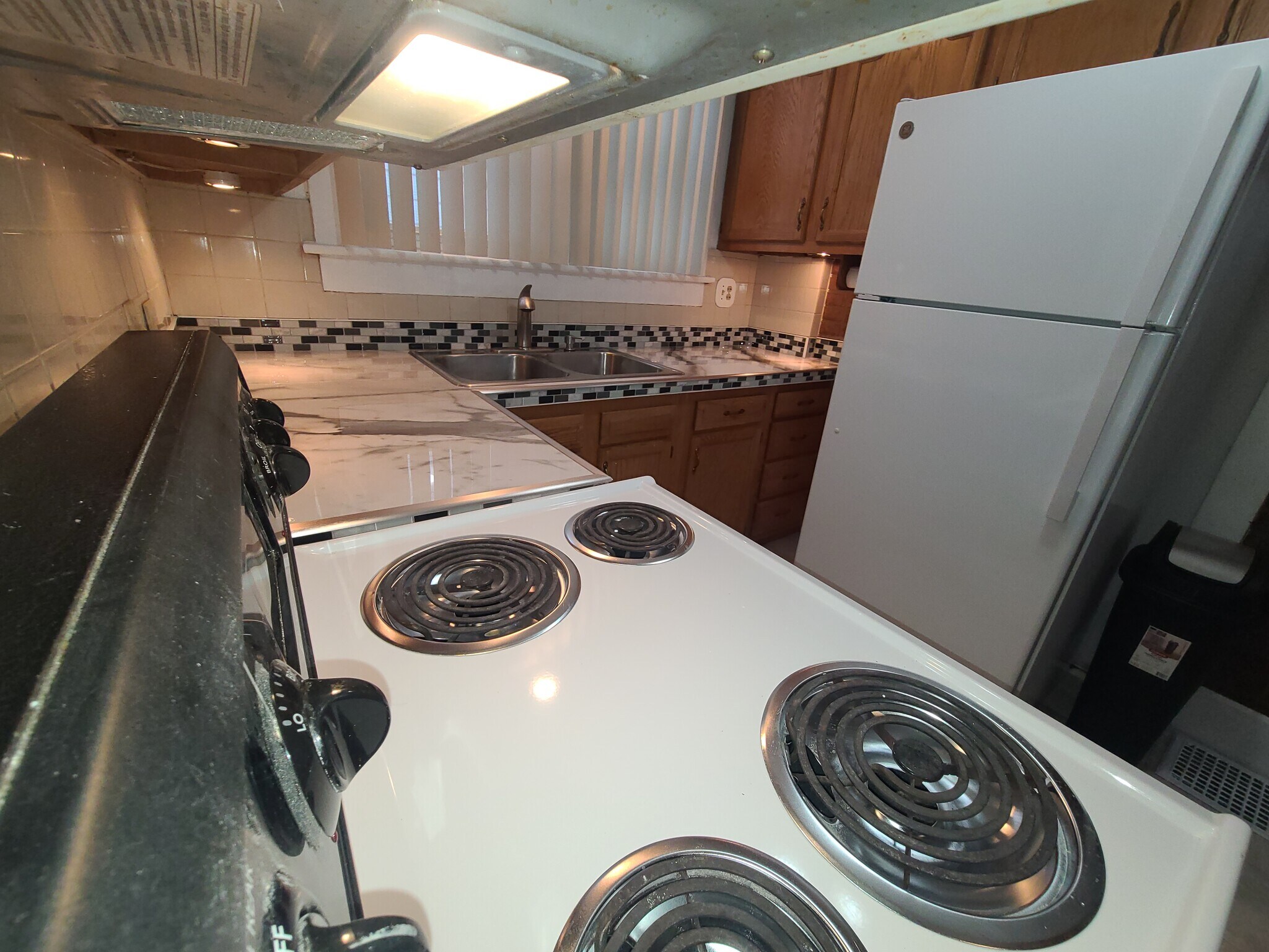 Looking through pass through to kitchen and new quartz countertops - 122 Edgerton Rd