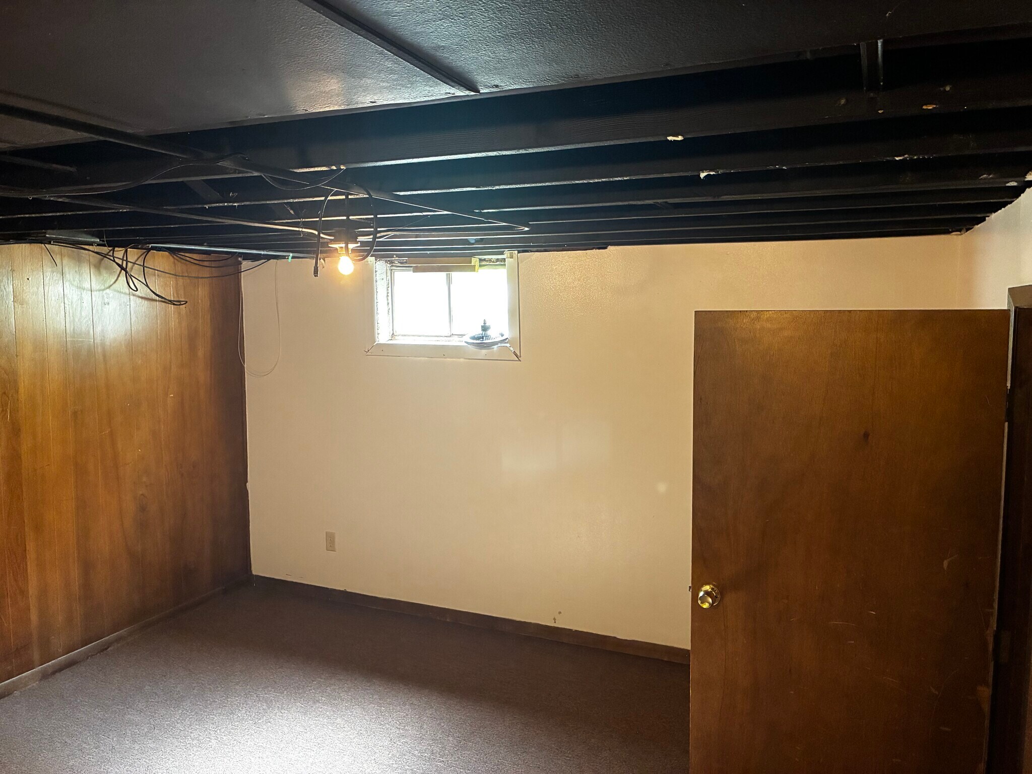 The finished portion of the basement has alot of space for a play room or office - 1205 Randolph St