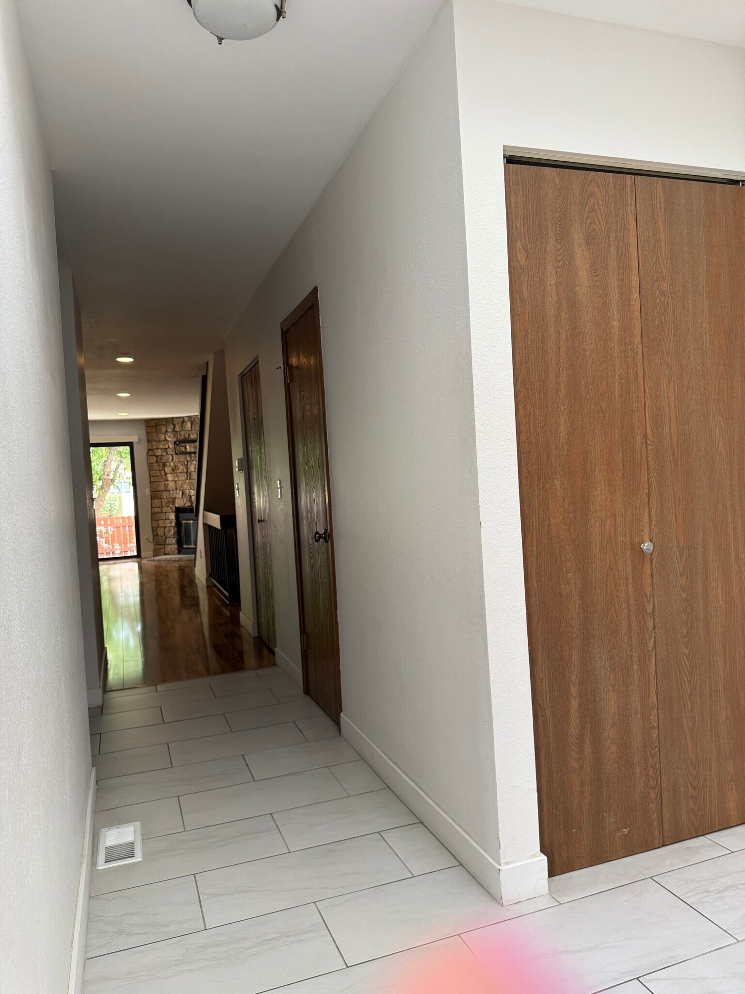 Hall with Main Floor 1/2 Bathroom Door - 7474 E Arkansas Ave