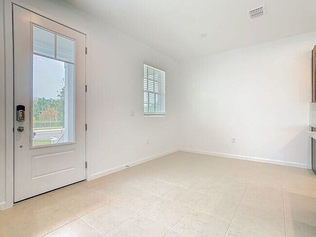 Building Photo - New Luxury Townhome in Celebration, FL Corner unit. All porcelain tiled floors. Aleutian model by...