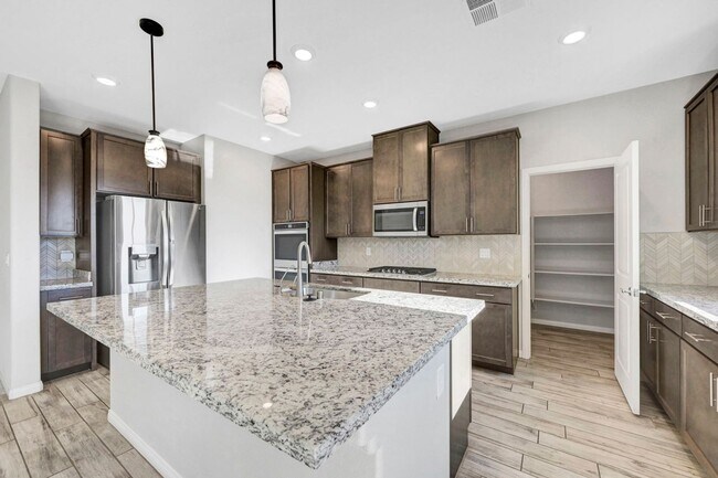 Building Photo - Gated community Located within the Valley Vista Master Plan. 4 Bed 3 Bath features and Open and i...