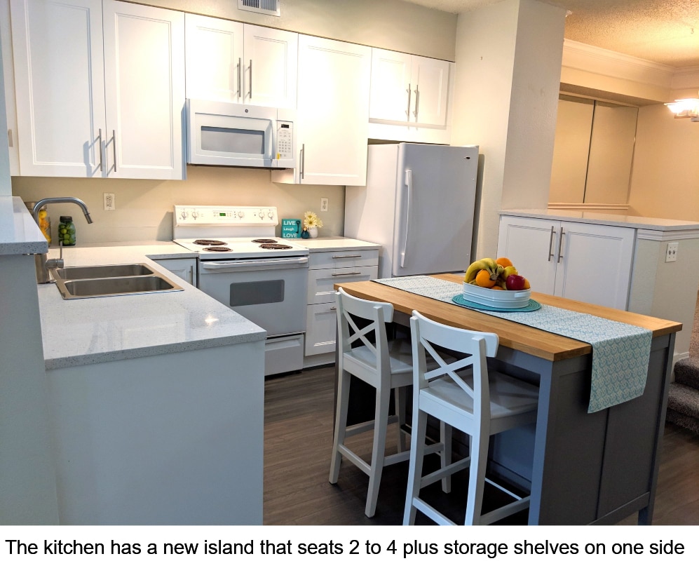 The kitchen has a new island with seating and storage space - 1942 Oxford Ln