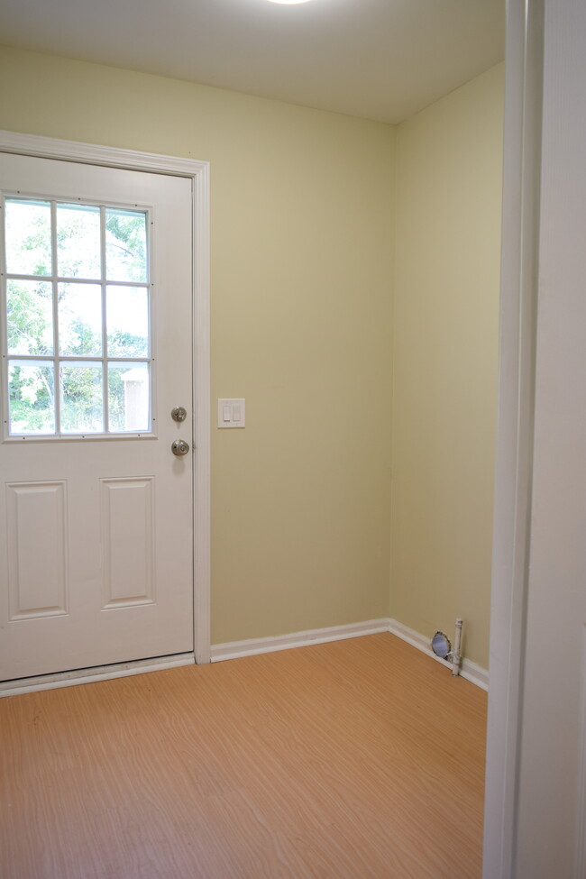 Laundry room and back door. - 381 Ferry Ave