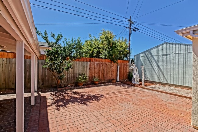 Building Photo - SPACIOUS, BRIGHT & AIRY, 3BR2BA HOME W/ GREAT OUTDOOR SPACE, LARGE DRIVEWAY W/ COVERED CARPORT & ...