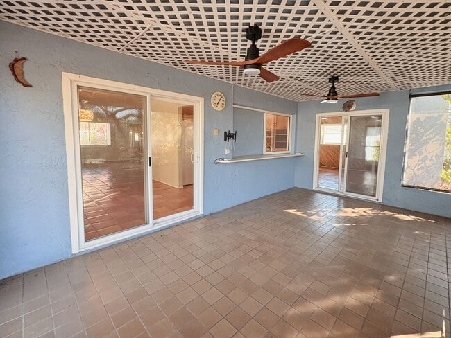 Building Photo - 3 Bed 2 Bath Home with Large Fenced Backyard & Screened Lanai — Available Now