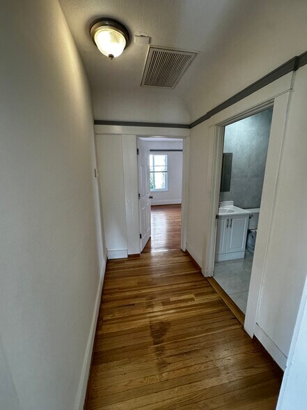 Hall to restroom & Bedroom 2 - 1200 N Hoover St