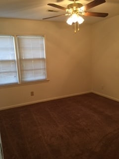 Building Photo - Brick Home with Carport & Fenced yard