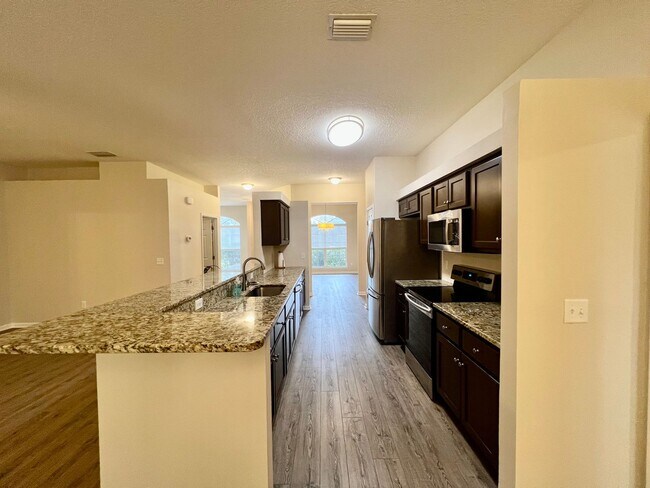 Building Photo - Behind the Gates: A Corner-Lot 4 bedroom, 2 bath Retreat in Coveted Pace Island!!