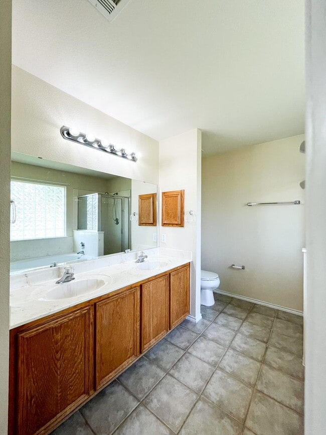 Building Photo - Available Now Beautiful 1 story, 4 bedroom, 2 bath, 2 car garage home with fire place, garage doo...