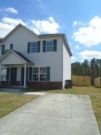 Building Photo - Pleasant two bedroom one and a half bath town home. Close to schools, Camp Lejeune, area beaches,...
