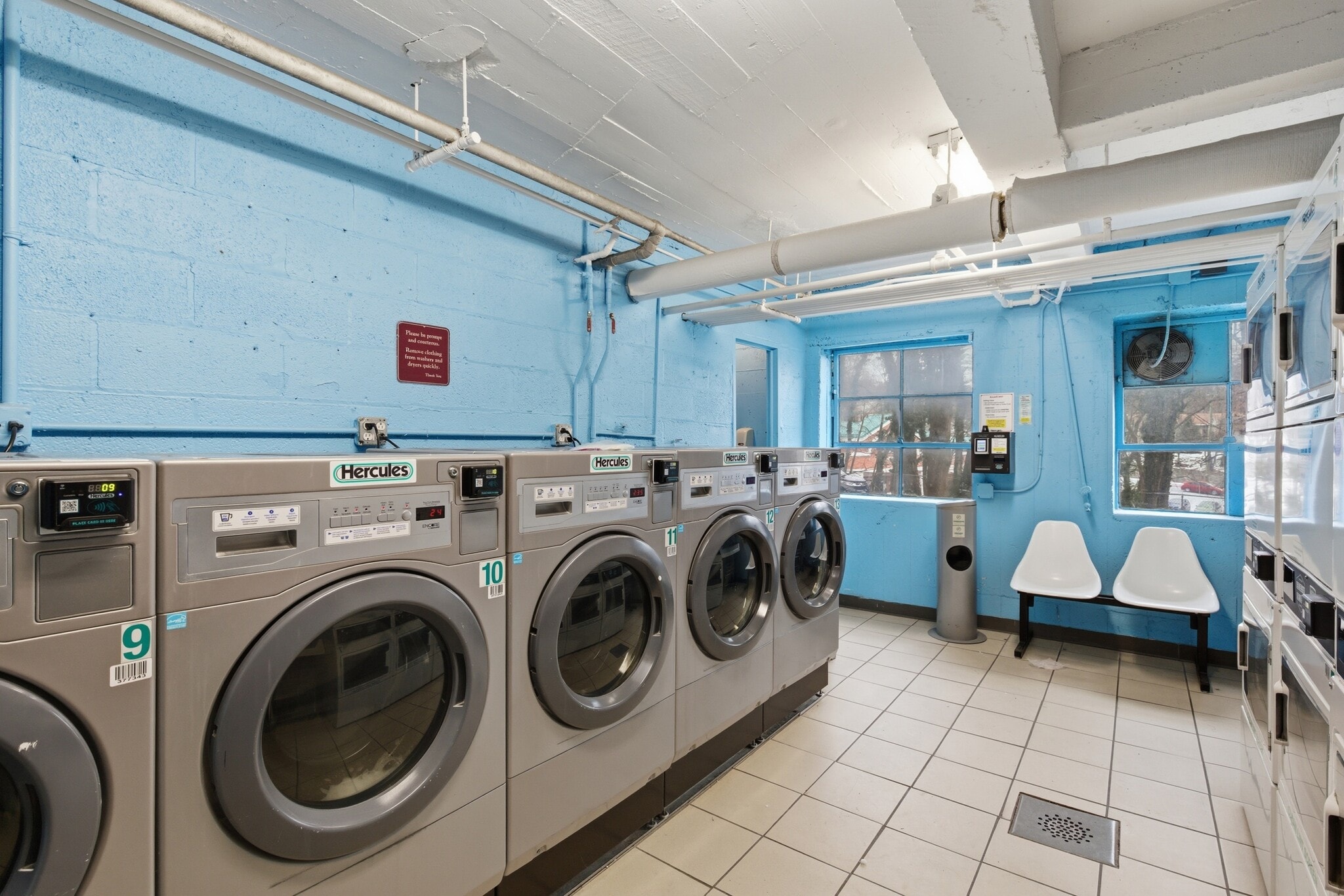 Community laundry featuring separate washer and dryer - 555 Broadway