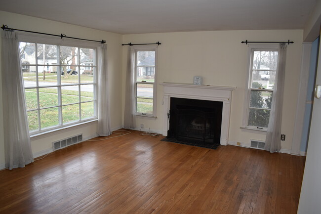 Front room with wood burning fireplace - 18921 Coffinberry Blvd