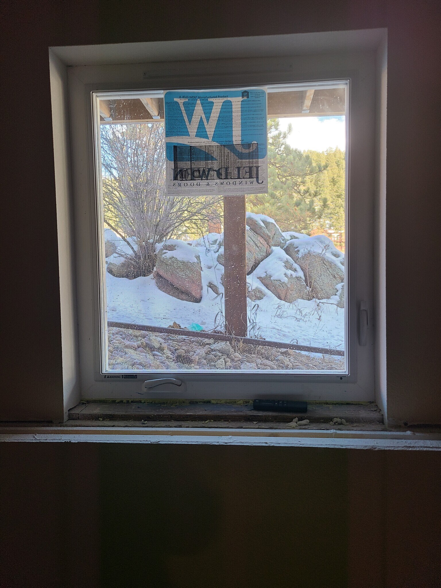 View of the ridge to the east and beautiful rocks from bedroom egress casement window. - 120 Wisp Creek Dr