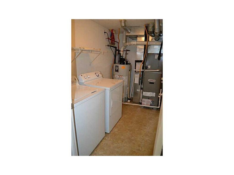 Lower Floor, Laundry Room. Before Garage. - 12668 Hollice Ln