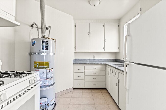 Building Photo - Renovated 1-Bedroom with Gated Parking & Garbage Paid!