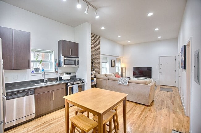 Building Photo - UK Village 2 Bedroom with Central Heat & A/C, In-Unit Laundry, Exposed Brick. Free Fast Internet ...