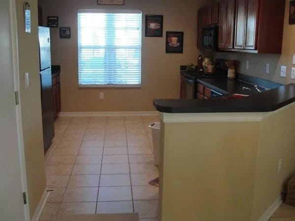 Kitchen from dining area - 2537 Harn Blvd