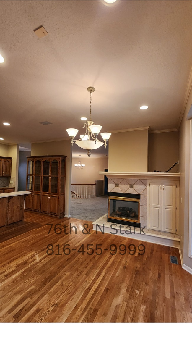 Two sided fireplace --- great focal point dividing spaces while maintaining openness and flow. - 6003 N Norton Ave