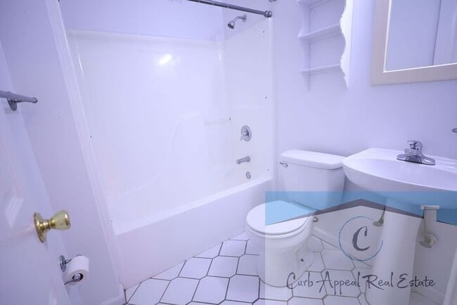 Building Photo - First month move in special $900!! Beautiful 3-bed, 2 bath condo with 2-car garage - includes was...