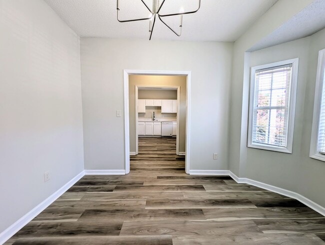 Building Photo - Move-In Ready Townhome with Downstairs Pri...