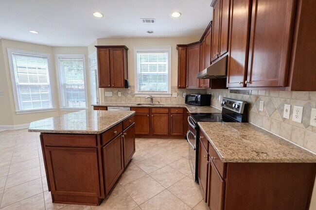 Building Photo - Clean 5 Bedroom Collins Hill Home with First Floor Suite and Oversized Master