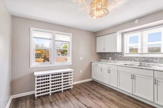 Building Photo - This spacious upper unit features 2 comfortable bedrooms with carpeting