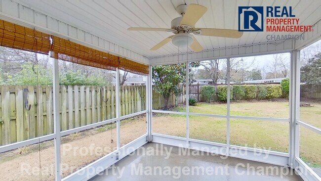 Building Photo - Beautiful home boasts open floorplan, screened porch, and spacious fenced yard