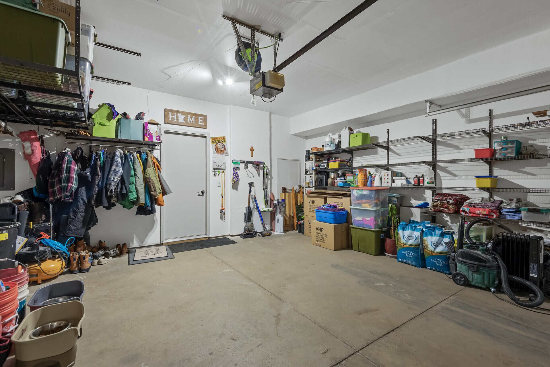 2 Stall Garage with Wall & Ceiling Storage. Insulated Garage Door - 13055 Europa Trail Way N