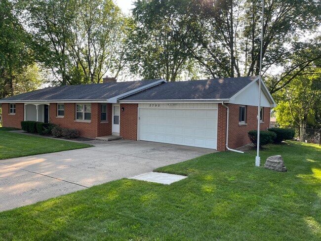 Two-stall, deep 700 sq ft garage. Flagpole located on right side of driveway - 2790 S Ridge Rd