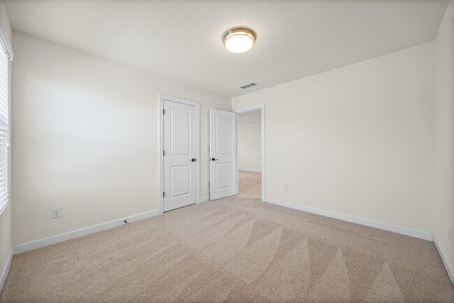 Building Photo - Classic finishes paired with an open, versatile layout!