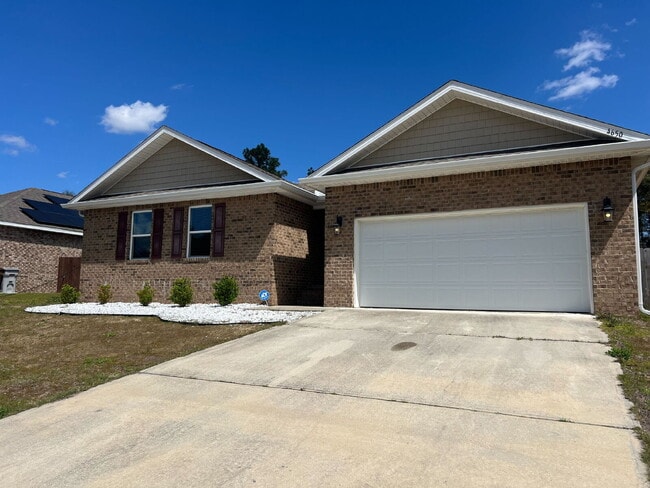 Building Photo - Spacious 4-Bed, 2-Bath East Milton Home with 2-Car Garage, Open-Concept Kitchen, Primary Suite, F...