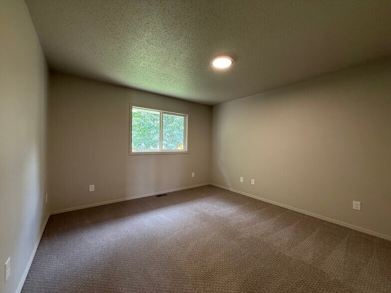 Upstairs bedroom #2 with new carpet and paint - 2005 S Gordon Dr