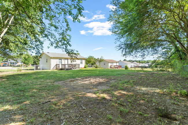 Fenced yard with private deck and plenty of space. Grill and outdoor furniture included. - 318 Atlantic Ave