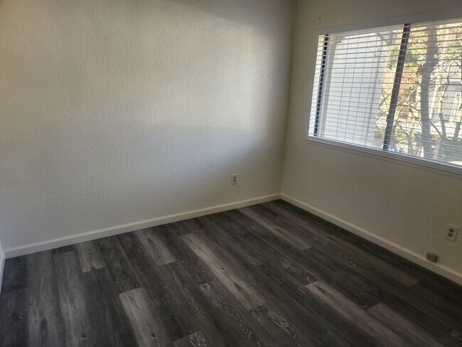 Building Photo - A Must See! Nice and bright, lots of light, two story condo in a well maintained complex.