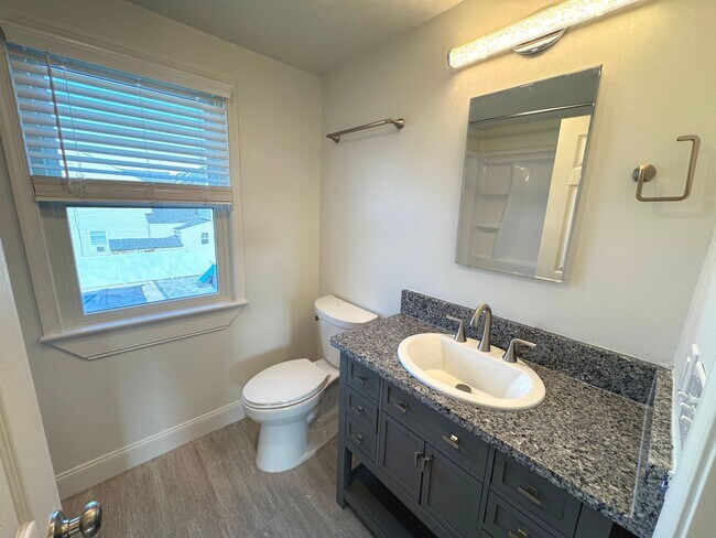 Building Photo - RENOVATED 3 bedroom end unit across the street from the Beach!